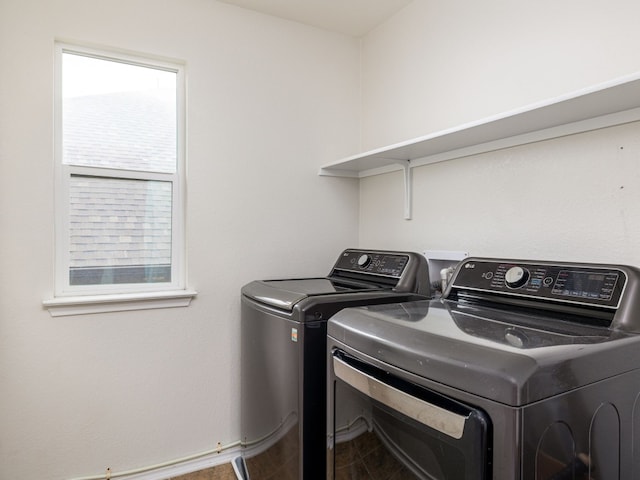 laundry area with independent washer and dryer