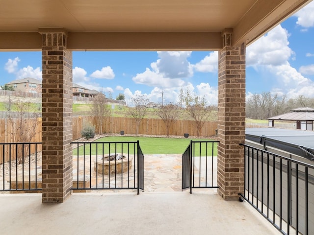 view of patio / terrace featuring an outdoor fire pit