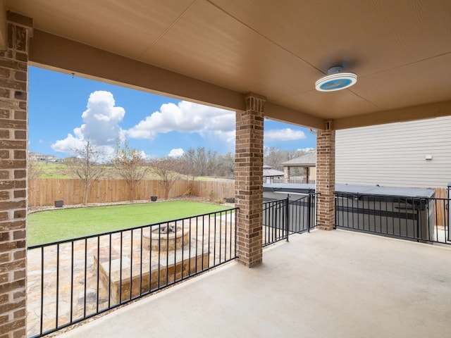 view of patio / terrace featuring a hot tub