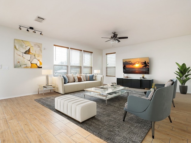 living room with rail lighting and ceiling fan