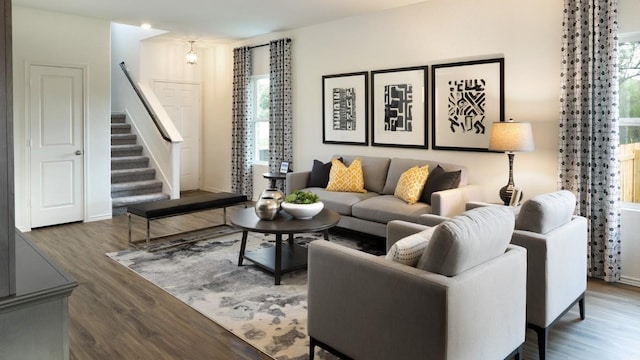 living room featuring dark hardwood / wood-style flooring and plenty of natural light