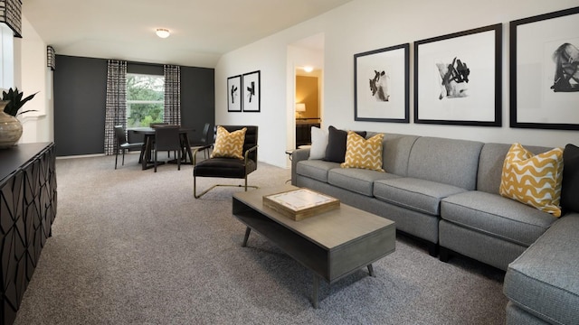 carpeted living room with lofted ceiling