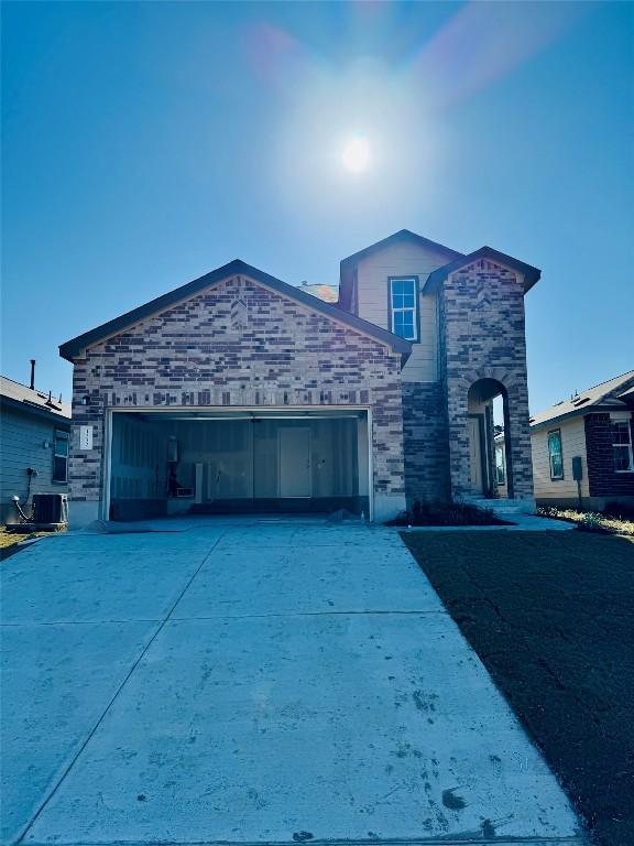 view of front of home featuring central AC unit