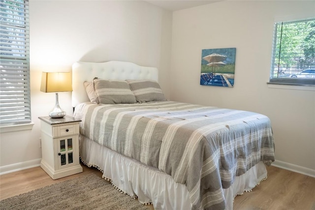 5201 Periwinkle Path, Austin, TX 78745 - bedroom with light wood finished floors
