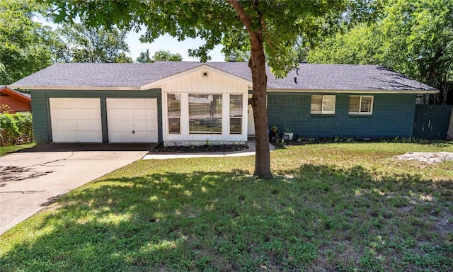 5201 Periwinkle Path, Austin, TX 78745 - ranch-style home featuring driveway, brick siding, a garage, and a front lawn