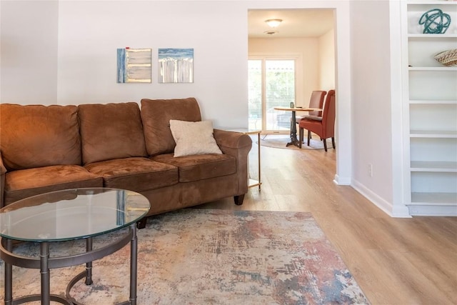 5201 Periwinkle Path, Austin, TX 78745 - living area featuring wood finished floors and built in features