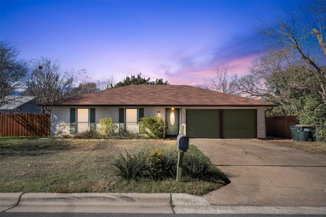 single story home with a garage