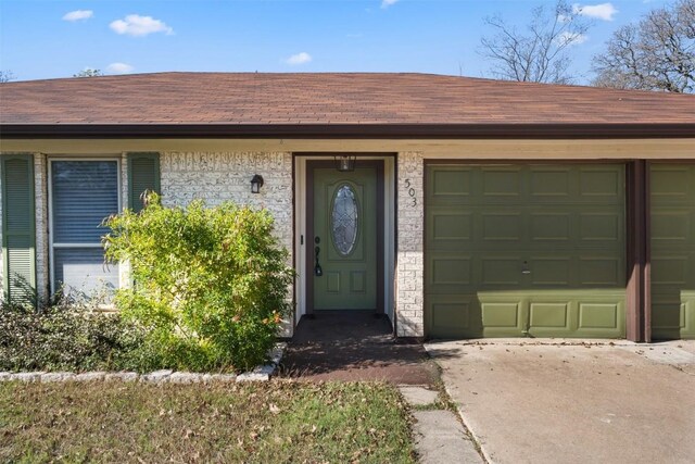 entrance to property with a garage