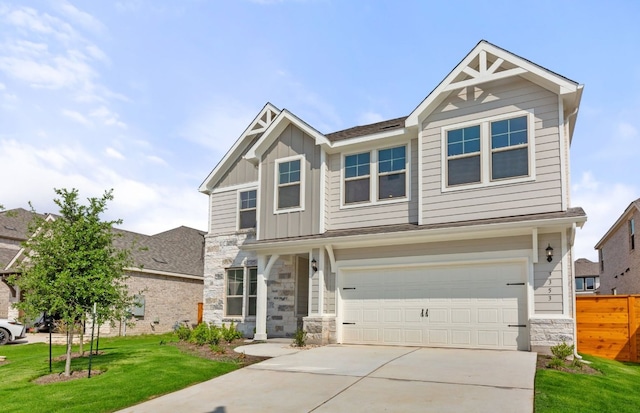 3353 Vestland Fjord St, Leander, TX 78641 - craftsman-style house featuring a garage, a front lawn, stone siding, board and batten siding, and driveway
