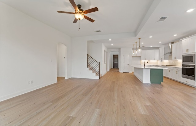 3353 Vestland Fjord St, Leander, TX 78641 - unfurnished living room with a sink, recessed lighting, light wood-type flooring, and visible vents