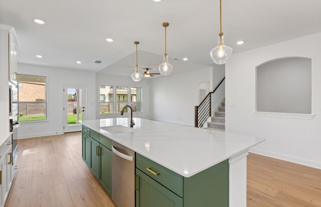 3353 Vestland Fjord St, Leander, TX 78641 - kitchen with a sink, light wood-style flooring, green cabinetry, and dishwasher