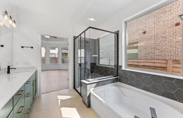 3353 Vestland Fjord St, Leander, TX 78641 - bathroom featuring vanity, ceiling fan, a bath, and a shower stall