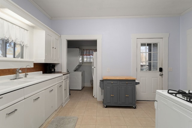 kitchen with ornamental molding, white appliances, sink, white cabinets, and gray cabinets