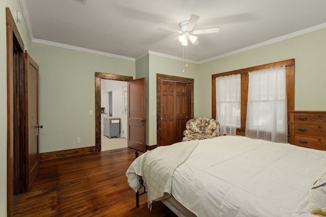 bedroom featuring ceiling fan, a closet, crown molding, and dark wood-type flooring