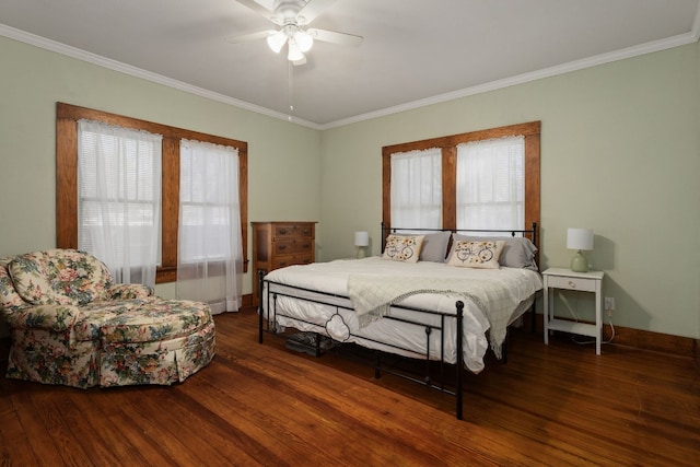 bedroom featuring ceiling fan, ornamental molding, dark wood-type flooring, and multiple windows