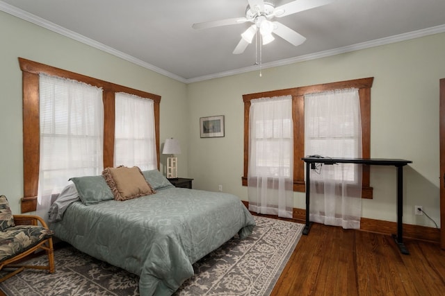 bedroom with ceiling fan, crown molding, and dark wood-type flooring