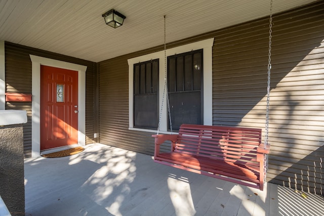 doorway to property featuring covered porch