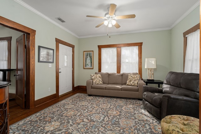 living room featuring crown molding, hardwood / wood-style floors, and ceiling fan