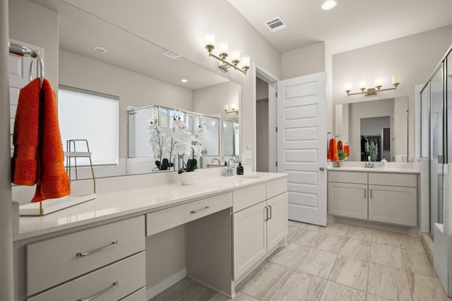 bathroom with vanity and an enclosed shower