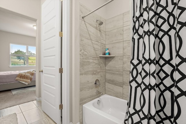 bathroom with tile patterned floors and shower / bath combo with shower curtain