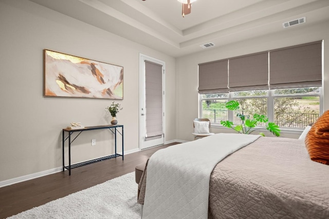 bedroom featuring dark hardwood / wood-style floors and ceiling fan