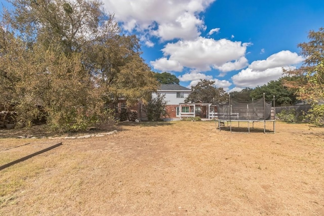 30102 Carmel Bay St, Georgetown, TX 78628 - view of green lawn featuring a trampoline