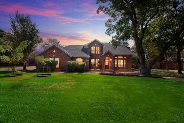 view of front of property with a lawn