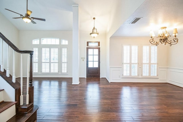 30102 Carmel Bay St, Georgetown, TX 78628 - foyer entrance with stairway, a wainscoted wall, dark wood-style flooring, a chandelier, and a ceiling fan