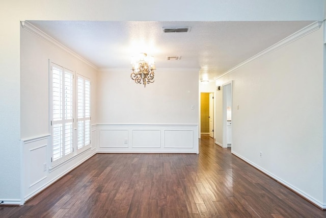 30102 Carmel Bay St, Georgetown, TX 78628 - spare room with a chandelier, dark wood-type flooring, crown molding, and wainscoting