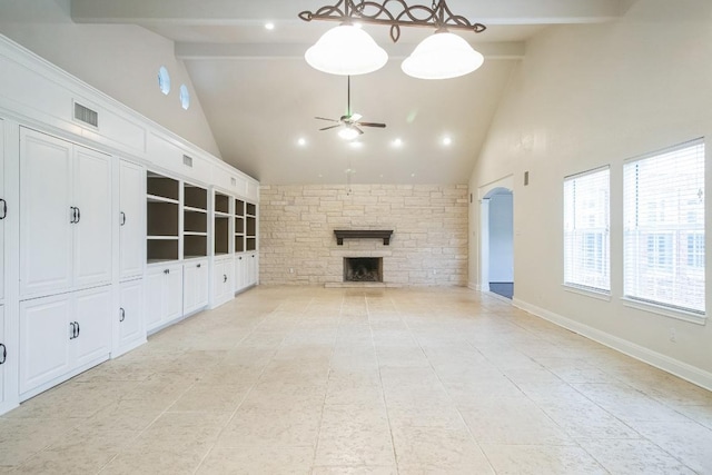 30102 Carmel Bay St, Georgetown, TX 78628 - unfurnished living room featuring high vaulted ceiling, ceiling fan, a fireplace, beamed ceiling, and light tile patterned floors