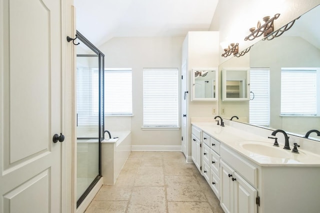 30102 Carmel Bay St, Georgetown, TX 78628 - bathroom featuring lofted ceiling, double vanity, a bath, and a shower with shower door