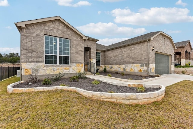 view of front of property with a garage and a front lawn