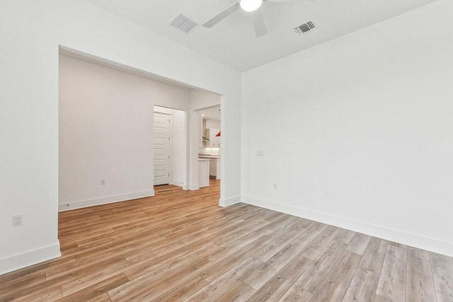 spare room featuring ceiling fan and light hardwood / wood-style flooring