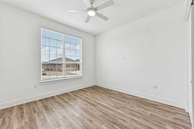 empty room featuring ceiling fan and light wood-type flooring