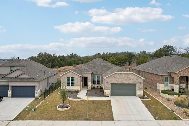 view of front of house featuring a garage and a front lawn