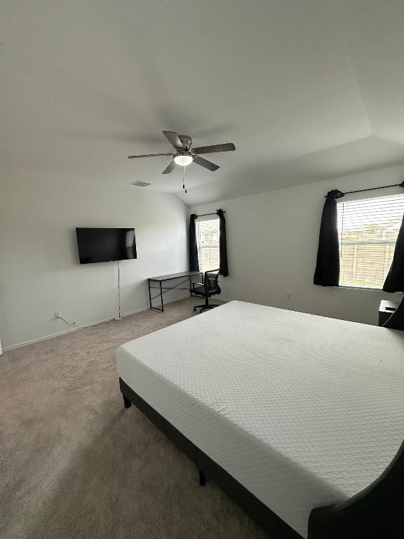 carpeted bedroom featuring ceiling fan