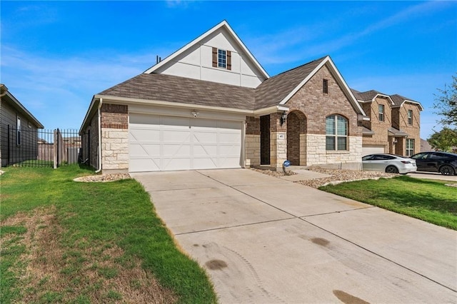 front of property with a garage and a front lawn