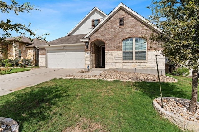 view of front of property with a garage and a front lawn