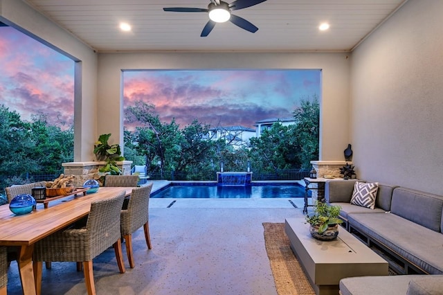 pool at dusk with ceiling fan