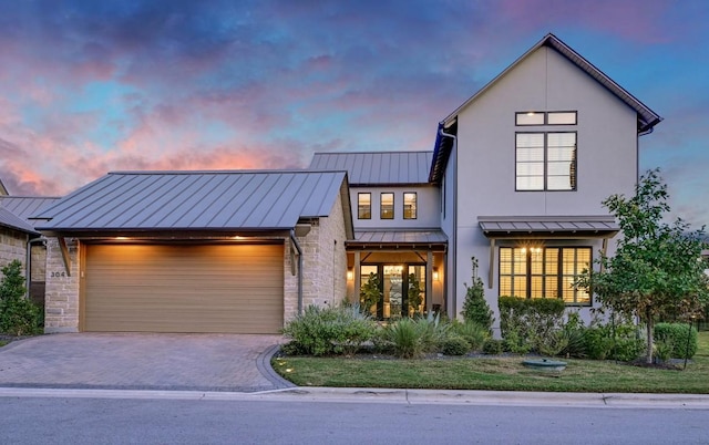 modern inspired farmhouse featuring a garage