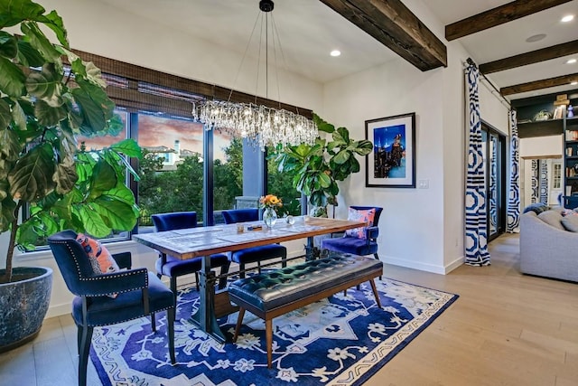 dining space featuring hardwood / wood-style floors, a notable chandelier, and beam ceiling