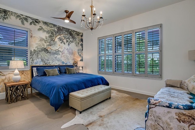 bedroom featuring hardwood / wood-style flooring, multiple windows, and a notable chandelier