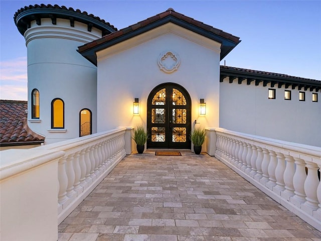 exterior entry at dusk with french doors