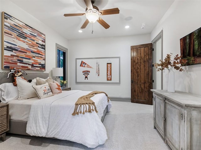 carpeted bedroom featuring ceiling fan