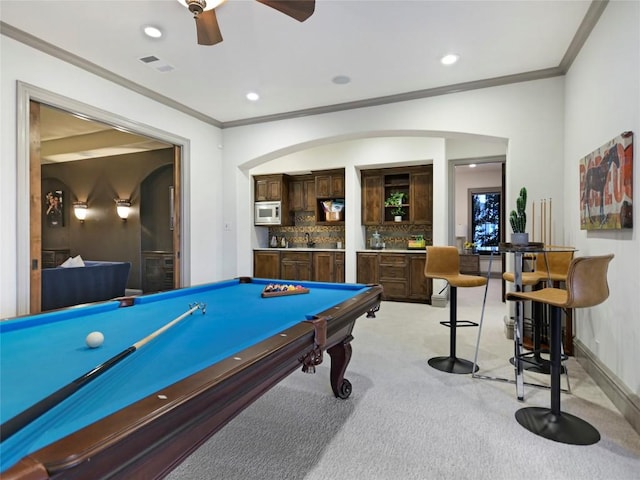 recreation room with light colored carpet, crown molding, and billiards