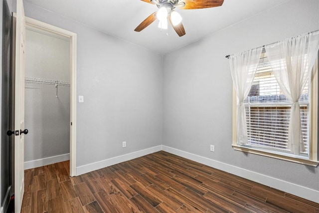 unfurnished bedroom featuring ceiling fan and a closet