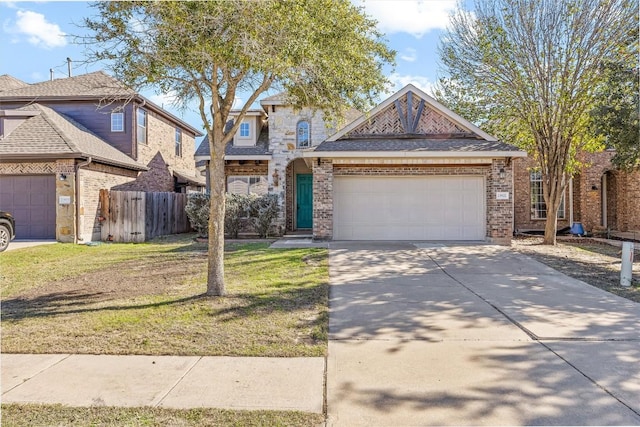 view of front facade featuring a front yard and a garage