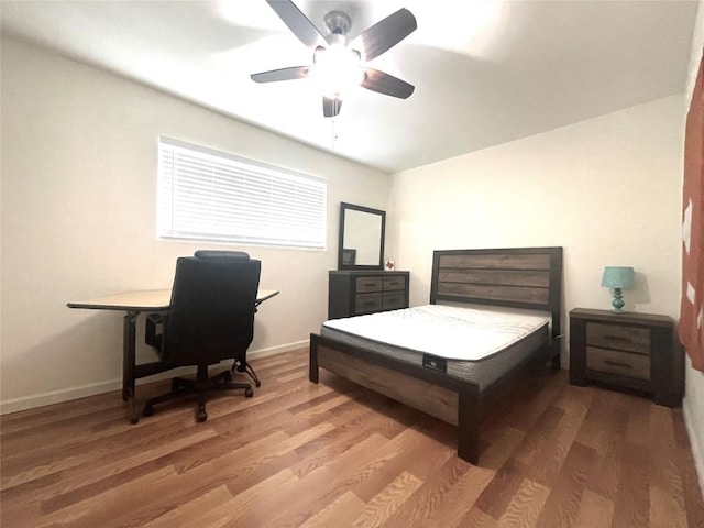 bedroom featuring ceiling fan and hardwood / wood-style floors