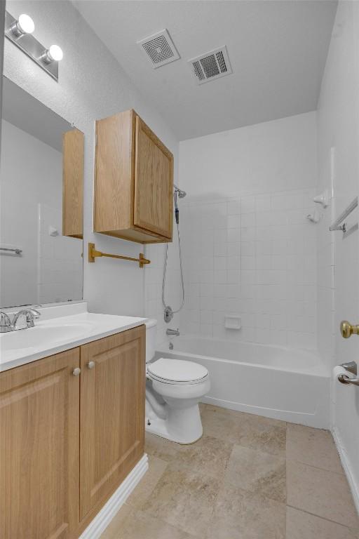 full bathroom featuring vanity, shower / bathing tub combination, and toilet