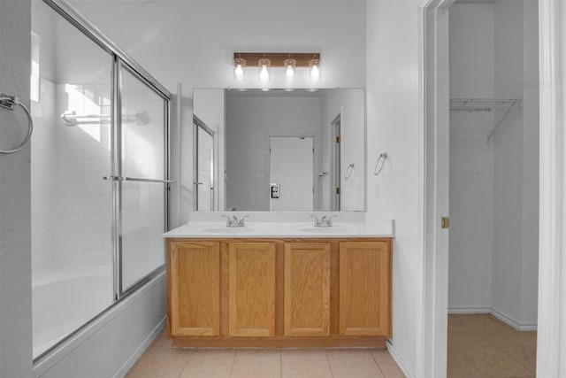 bathroom with shower / bath combination with glass door, tile patterned floors, and vanity